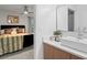 Modern bathroom featuring updated fixtures, large mirror, and vanity with storage at 4771 N Springs Nw Rd, Kennesaw, GA 30144