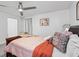 Comfortable bedroom with soft carpet, neutral paint, ceiling fan, and large windows for natural light at 4771 N Springs Nw Rd, Kennesaw, GA 30144