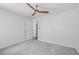Neutral bedroom featuring plush carpet and a modern ceiling fan at 4771 N Springs Nw Rd, Kennesaw, GA 30144