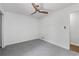 Neutral bedroom features plush carpet and a modern ceiling fan at 4771 N Springs Nw Rd, Kennesaw, GA 30144