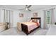 Comfortable bedroom featuring soft carpet, a ceiling fan, and great windows for natural light at 4771 N Springs Nw Rd, Kennesaw, GA 30144