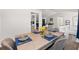 Dining area is furnished with dining set and adjacent to other living areas at 4771 N Springs Nw Rd, Kennesaw, GA 30144