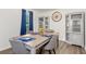 Bright dining room with neutral paint, wood flooring, furniture, and large windows for lots of natural light at 4771 N Springs Nw Rd, Kennesaw, GA 30144