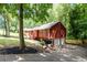Lovely home with a two-car garage, lush trees, and well-kept landscaping at 4771 N Springs Nw Rd, Kennesaw, GA 30144
