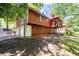 Side view of home featuring attached two-car garage and back porch at 4771 N Springs Nw Rd, Kennesaw, GA 30144