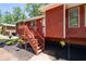Cozy front porch with new stairs and well-maintained landscaping at 4771 N Springs Nw Rd, Kennesaw, GA 30144