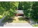 Charming home with inviting front yard, lush trees and curb appeal at 4771 N Springs Nw Rd, Kennesaw, GA 30144