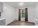 Bright eating area with window, laminate floors and open to kitchen at 4771 N Springs Nw Rd, Kennesaw, GA 30144