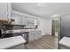 A modern kitchen featuring stainless steel appliances, gray cabinets, and stylish backsplash at 4771 N Springs Nw Rd, Kennesaw, GA 30144
