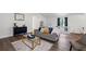 Bright living room features wood flooring, neutral paint, modern furnishings, and lots of natural light at 4771 N Springs Nw Rd, Kennesaw, GA 30144