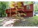 View of the rear exterior elevation with a wood deck overlooking a spacious yard at 4771 N Springs Nw Rd, Kennesaw, GA 30144