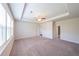 Spacious bedroom features a trey ceiling, neutral carpet, and two entry doors at 5789 Creek Indian Dr, Sugar Hill, GA 30518