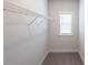 A walk-in closet space with wire shelving and a window for natural light at 5789 Creek Indian Dr, Sugar Hill, GA 30518