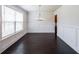 Bright dining room featuring wainscoting, modern lighting, and large windows at 5789 Creek Indian Dr, Sugar Hill, GA 30518