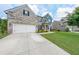 Charming two-story home with a large driveway and a two car garage at 5789 Creek Indian Dr, Sugar Hill, GA 30518