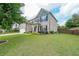 Well maintained two-story home with beautiful landscaping and an attached garage at 5789 Creek Indian Dr, Sugar Hill, GA 30518