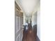 Elegant foyer with hardwood floors, a staircase, and white trim at 5789 Creek Indian Dr, Sugar Hill, GA 30518