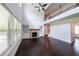 Bright living room with a fireplace, built-in bookshelves, and cathedral ceilings at 5789 Creek Indian Dr, Sugar Hill, GA 30518