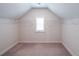 Unfinished walk-in closet with wire shelving, carpet flooring, and natural light at 5789 Creek Indian Dr, Sugar Hill, GA 30518