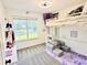 A bright and fun bedroom with a bunk bed, natural light, and cozy carpet at 96 Wildwood Dr, Temple, GA 30179