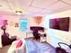 Cozy office area with a desk, multiple screens, and comfortable seating at 96 Wildwood Dr, Temple, GA 30179