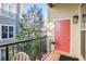 Outdoor balcony with a black metal railing, plants, and comfortable chairs at 1195 Milton Se Ter # 2203, Atlanta, GA 30315