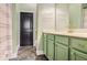 Bathroom featuring a large mirror and an array of cabinets under the countertop at 1195 Milton Se Ter # 2203, Atlanta, GA 30315