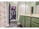 Bathroom boasts green vanity, walk-in closet, and modern fixtures at 1195 Milton Se Ter # 2203, Atlanta, GA 30315
