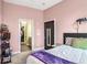Cozy bedroom with pink walls, ensuite bathroom, and a large closet at 1195 Milton Se Ter # 2203, Atlanta, GA 30315
