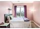 Cozy bedroom featuring a queen bed, plush bedding, and ample natural light, perfect for relaxation at 1195 Milton Se Ter # 2203, Atlanta, GA 30315