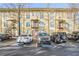 Apartment building featuring three levels with parking in front and exterior stairs at 1195 Milton Se Ter # 2203, Atlanta, GA 30315