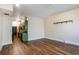 Open-concept space with hardwood floors; the living room flows into the kitchen at 1195 Milton Se Ter # 2203, Atlanta, GA 30315