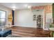 Bright living room featuring hardwood floors, wall decor, and large windows, perfect for relaxing or entertaining at 1195 Milton Se Ter # 2203, Atlanta, GA 30315