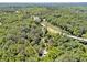 Aerial view of a home with lush greenery and a highway nearby at 13795 Arnold Mill Rd, Roswell, GA 30075
