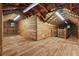 Large unfinished attic space with wooden beams and flooring, offering potential for customization at 13795 Arnold Mill Rd, Roswell, GA 30075
