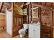 Unfinished attic bathroom with shower and sink featuring rustic wood accents at 13795 Arnold Mill Rd, Roswell, GA 30075