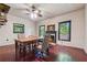 Dining room with unique spiral staircase, fireplace, and natural light from windows at 13795 Arnold Mill Rd, Roswell, GA 30075