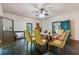 Bright dining room featuring classic decor, natural light, and a ceiling fan at 13795 Arnold Mill Rd, Roswell, GA 30075