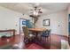 Open dining area with spiral staircase, wood floors, and natural light at 13795 Arnold Mill Rd, Roswell, GA 30075