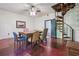 Cozy dining area with natural light, spiral staircase and wood floors at 13795 Arnold Mill Rd, Roswell, GA 30075