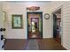 Inviting foyer featuring white walls, wood floors, and charming decorative accents at 13795 Arnold Mill Rd, Roswell, GA 30075