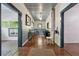 Hallway featuring hardwood floors, wainscoting, and an open layout leading to other rooms at 13795 Arnold Mill Rd, Roswell, GA 30075