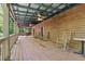 Wide covered porch with ceiling fans and rocking chairs, perfect for relaxation at 13795 Arnold Mill Rd, Roswell, GA 30075