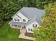 Aerial view of a beautiful home with a well-manicured lawn and mature trees at 25 Grange Ct, Sharpsburg, GA 30277
