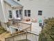 A multi-level back deck features wooden stairs and ample space for seating, grilling, and other outdoor activities at 25 Grange Ct, Sharpsburg, GA 30277