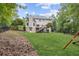 Expansive backyard featuring a well-maintained lawn, perfect for various outdoor activities at 25 Grange Ct, Sharpsburg, GA 30277
