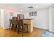 Basement bar area boasts a refrigerator and seating for four for great entertainment at 25 Grange Ct, Sharpsburg, GA 30277