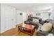 Finished basement area featuring a comfortable sectional and adjacent bar for entertaining at 25 Grange Ct, Sharpsburg, GA 30277