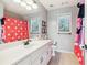 Bright bathroom with white vanity, large mirror, and cheerful polka-dot shower curtain at 25 Grange Ct, Sharpsburg, GA 30277