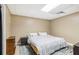 Cozy bedroom features neutral decor and a comfortable bed on top of a decorative rug at 25 Grange Ct, Sharpsburg, GA 30277